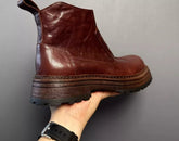 Brown leather ankle boot with chunky sole and smooth finish, modern streetwear style
