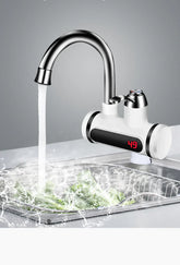 Modern kitchen faucet with digital temperature display, stainless steel finish, running water.