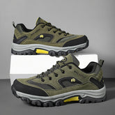 Olive green and black rugged outdoor sneakers with yellow accents, mesh panels, and thick soles