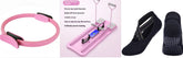 Pink exercise ring, pink foldable fitness board, and black non-slip ballet socks on white background.