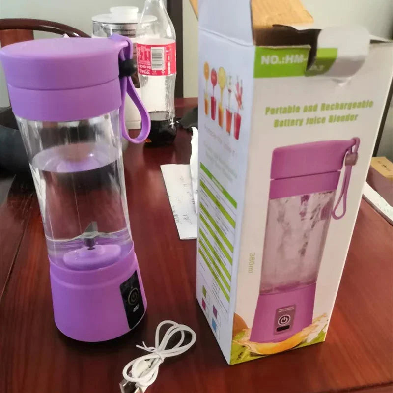 Purple portable battery-powered blender with clear plastic body and USB charging cable