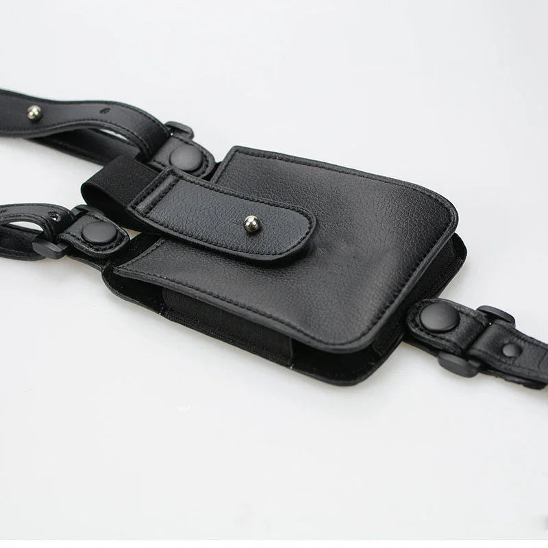 Black faux leather streetwear utility pouch with adjustable straps and metal snap closures