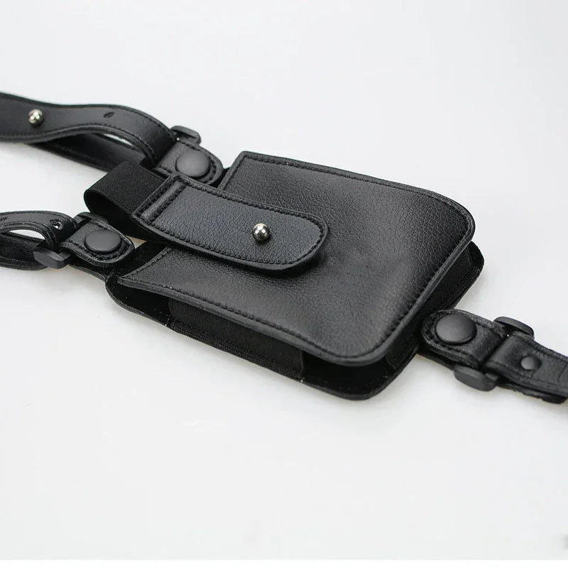 Black faux leather streetwear utility pouch with adjustable straps and metal snap closures