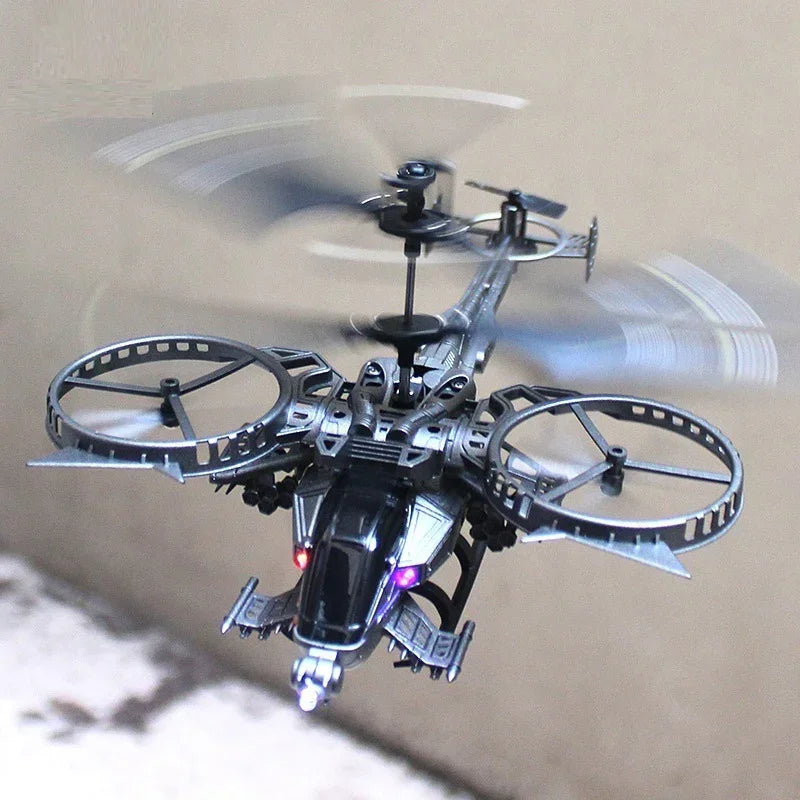 Futuristic black plastic toy helicopter drone with spinning rotors and LED lights in flight.
