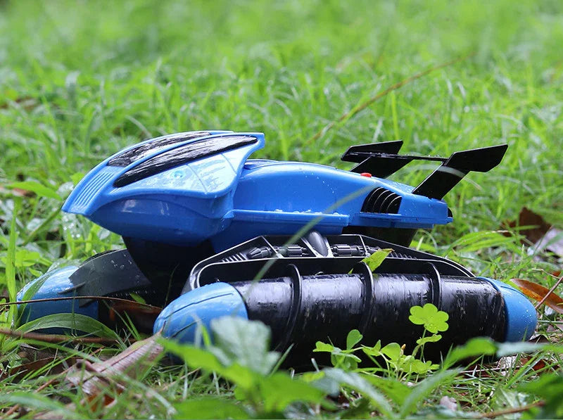 Blue futuristic remote control car toy with black wheels on grass outdoors