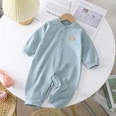 Light blue striped baby romper with snap buttons and long sleeves, soft cotton material, relaxed fit
