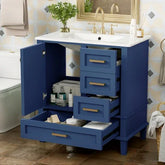 Blue bathroom vanity with gold handles, open drawers and cabinets, white countertop, modern design