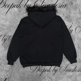 Black oversized hoodie with faux fur trim on hood, long sleeves, relaxed streetwear fit