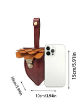 Brown and tan leather mini crossbody bag with layered flap, gold clasp, compact size shown next to smartphone.