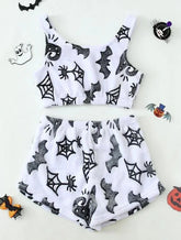 White fuzzy crop top and shorts set with black bat, spider web, and witch hat prints, Halloween theme.