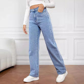 Woman wearing high-waisted light blue denim wide-leg jeans with a relaxed fit