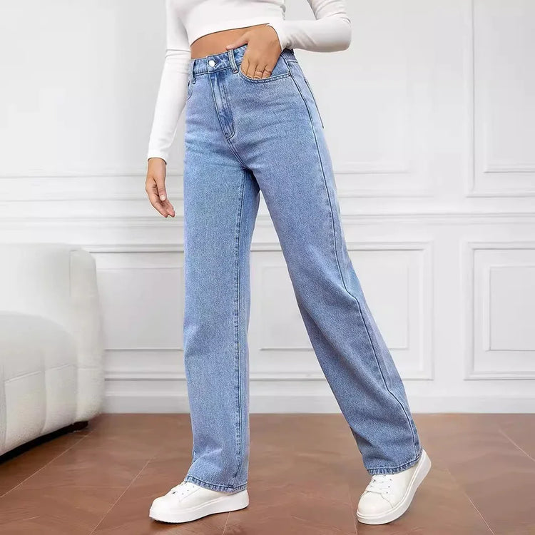 Woman wearing high-waisted light blue denim wide-leg jeans with a relaxed fit
