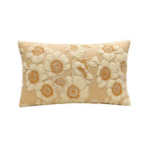 Rectangular beige cushion with embroidered cream and yellow floral pattern, textured fabric