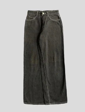 Wide leg black denim jeans with contrast stitching and relaxed fit on plain background