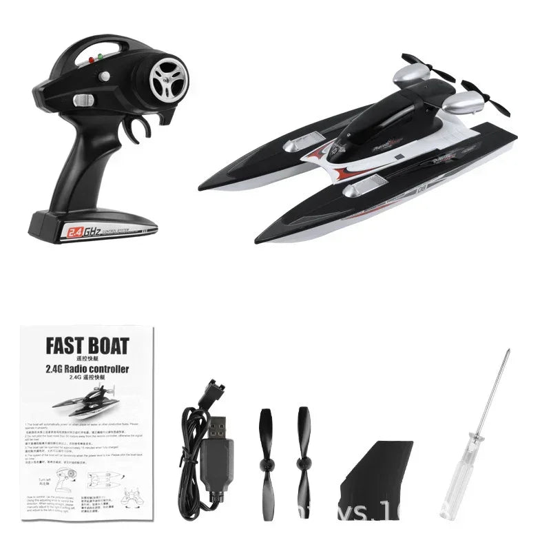 Black and white remote control speedboat set with controller, propellers, USB charger, and accessories