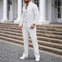 Man wearing slim fit white textured button-up shirt and matching drawstring trousers