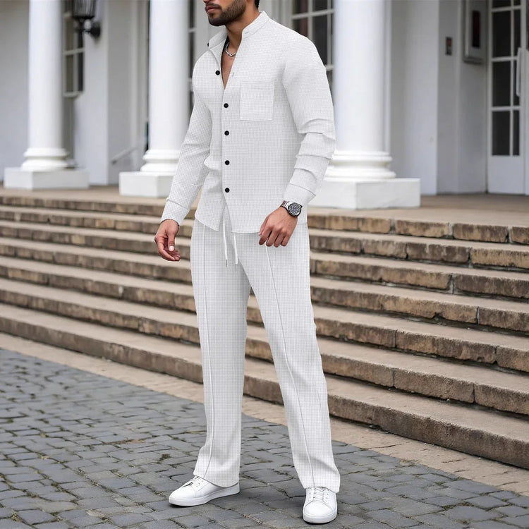 Man wearing slim fit white textured button-up shirt and matching drawstring trousers