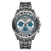 Silver stainless steel watch with ornate engraved band, blue chronograph subdials, and metallic dial