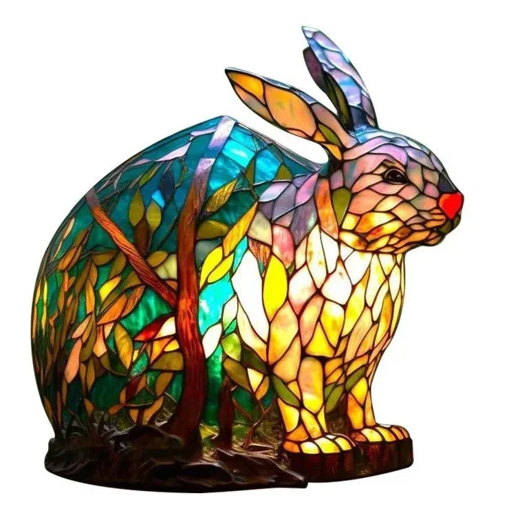 Stained glass rabbit lamp with colorful mosaic pattern and tree design, illuminated