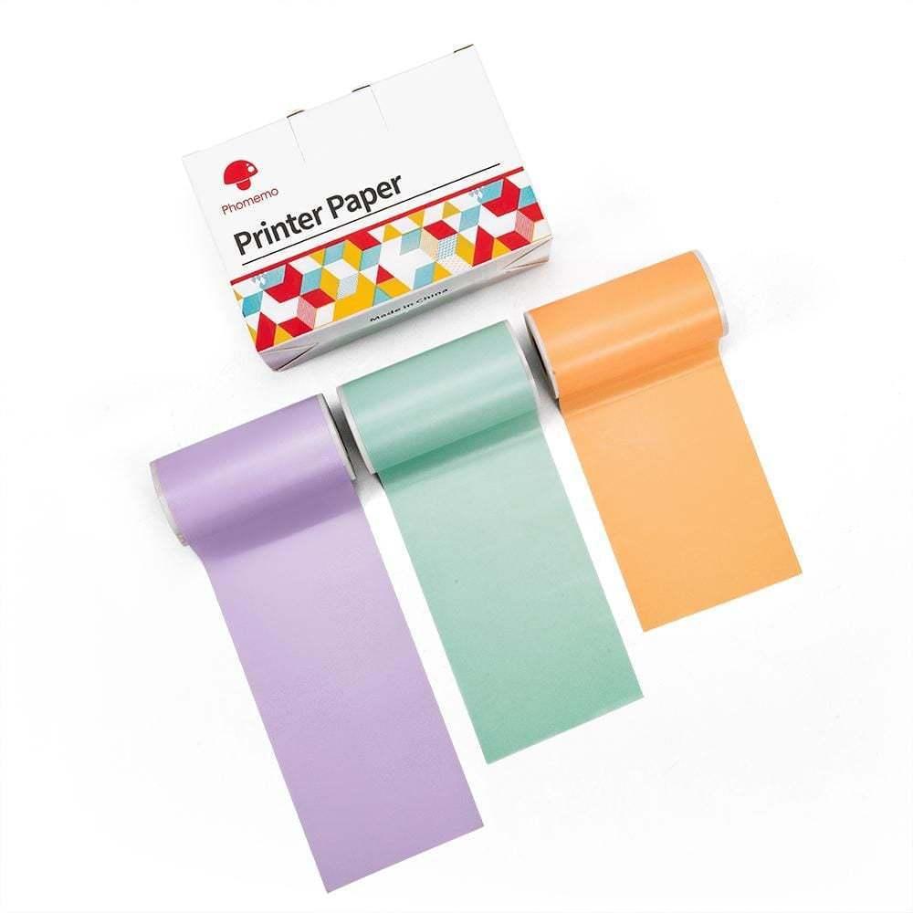 Three rolls of pastel thermal printer paper in purple, green, and orange next to packaging box