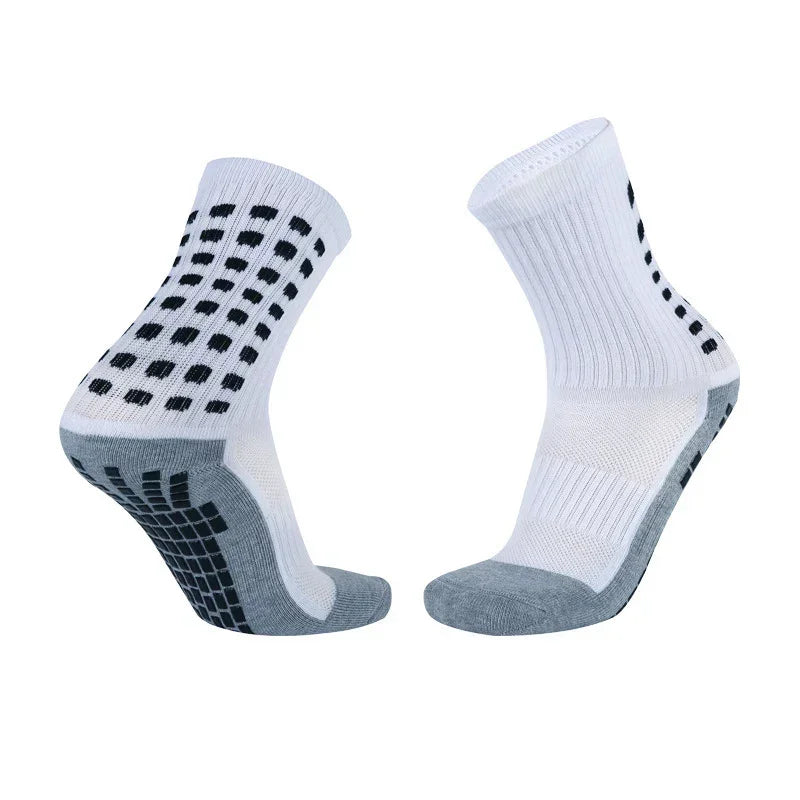 White and grey athletic crew socks with black non-slip grip, ribbed knit, cushioned sole