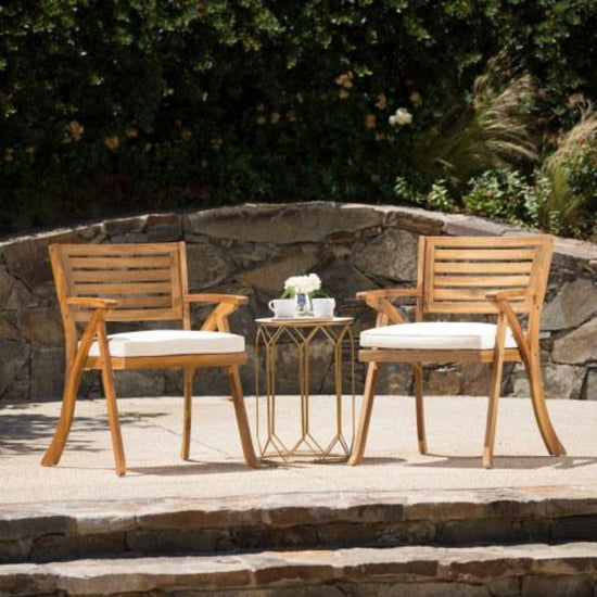 Outdoor Ermosa KD solid wood dining chair set with water-resistant cushions on patio