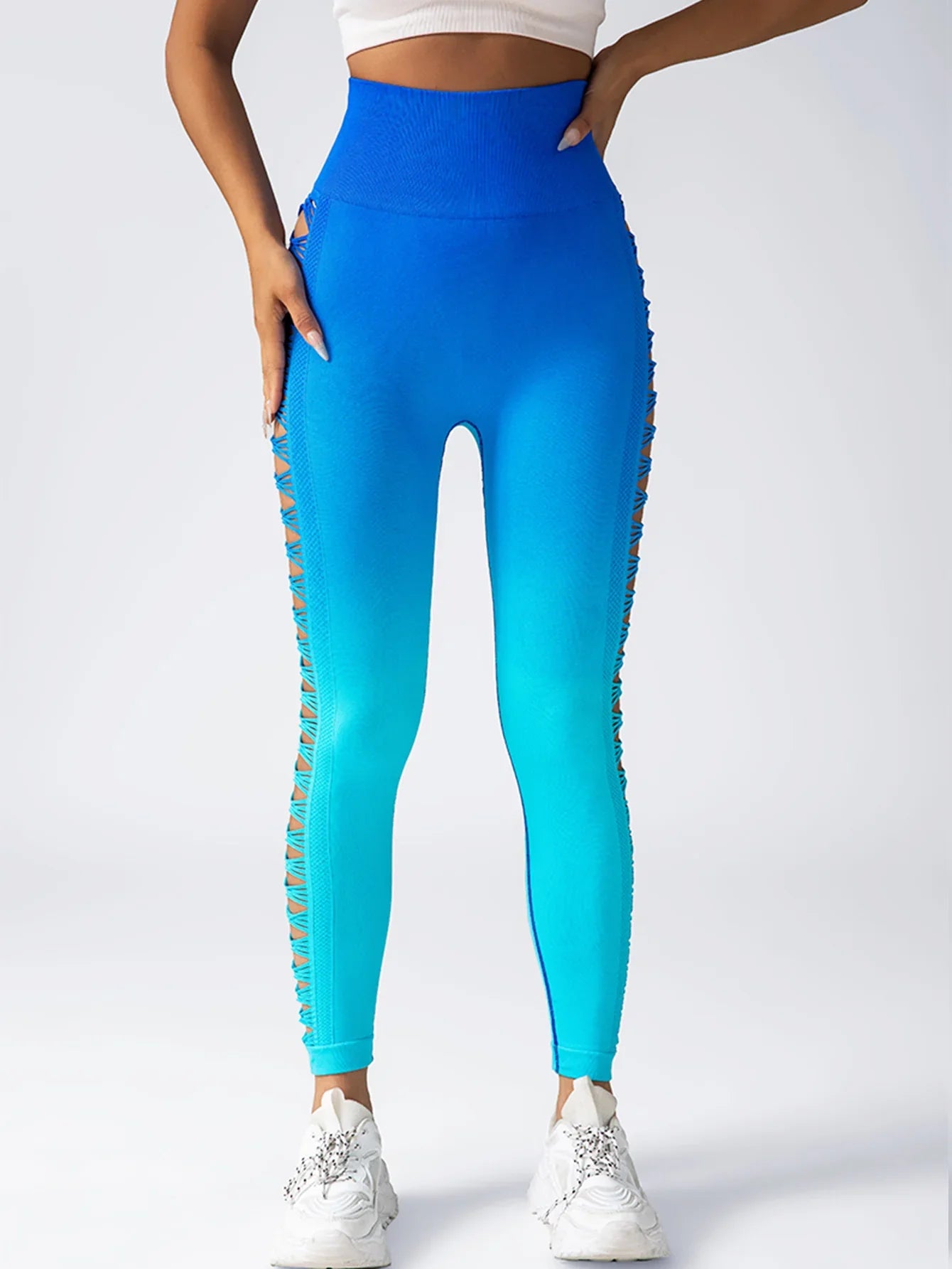 High-waisted blue ombre leggings with side cutout details, fitted stretchy fabric