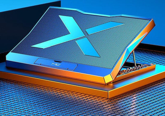 Futuristic metallic laptop with bold blue accents and angular design on a modern grid surface