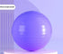 Glossy purple exercise yoga ball on a modern minimalistic display stand.