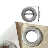 Silver textured curtain grommet on cream fabric, round shape 70mm outer, 40mm inner diameter.