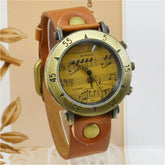 Vintage brown leather strap watch with brass case and musical notes dial, unisex fit.
