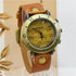 Vintage brown leather strap watch with brass case and musical notes dial, unisex fit.