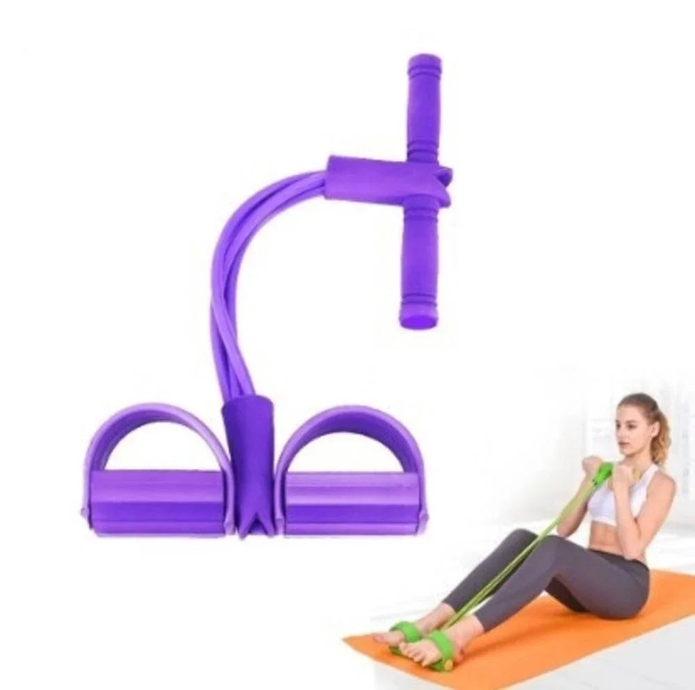 Woman in athleisure leggings and sports bra using purple resistance band on yoga mat