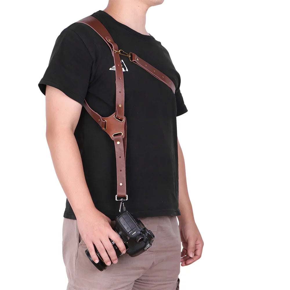 Man wearing a brown leather camera harness with adjustable straps, casual black t-shirt