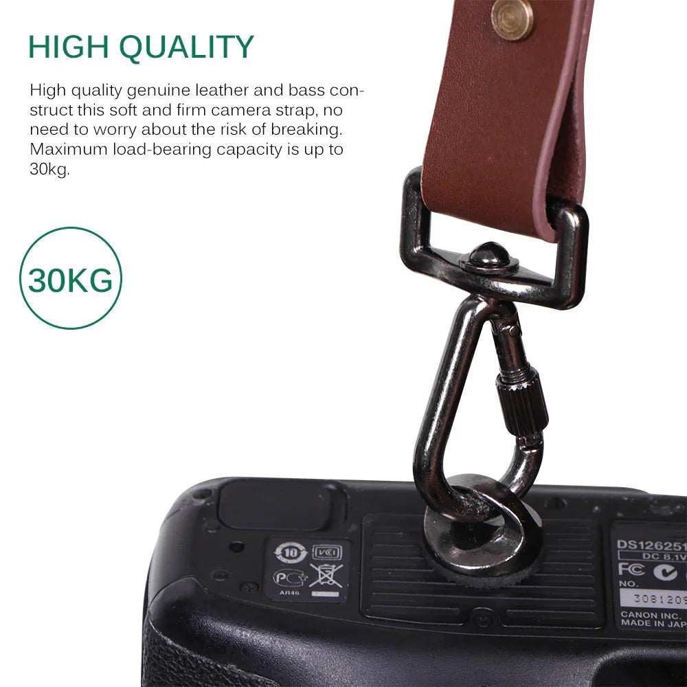 Brown genuine leather camera strap with metal clasp, attached to camera, durable and adjustable.