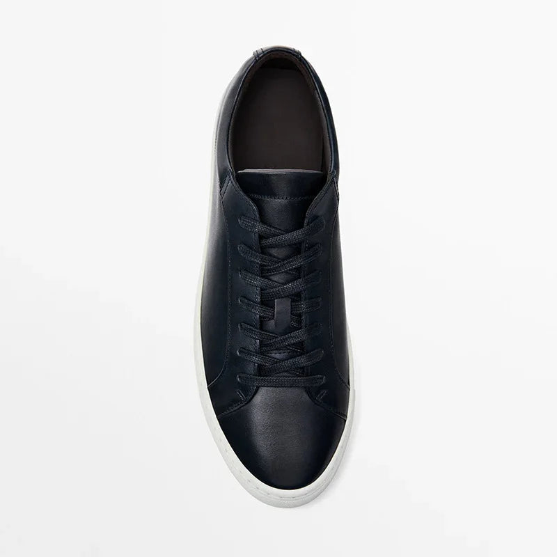 Black leather low-top sneaker with white sole, minimalist streetwear shoe design