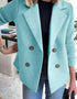 Woman wearing a light blue double-breasted wool blazer with ribbed sleeves and casual fit