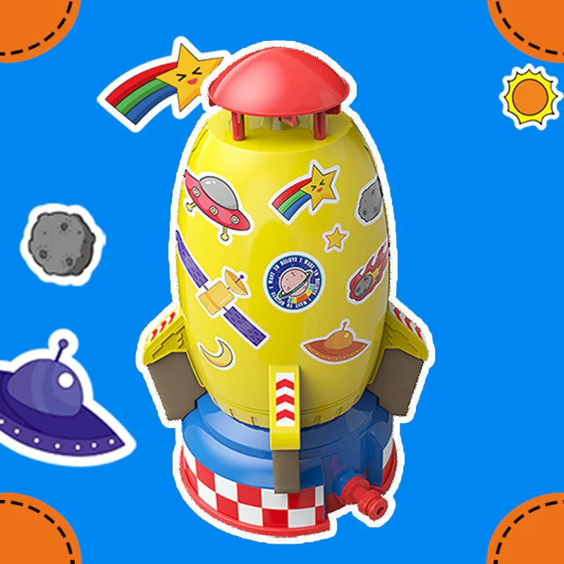 Colorful toy rocket with cartoon space stickers and red top, set against a bright blue background