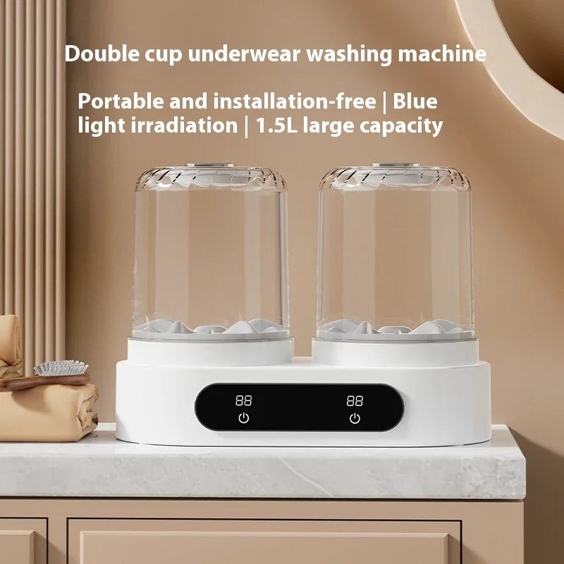 Double cup portable underwear washing machine, white, with digital display on marble countertop