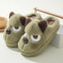 Plush green fuzzy slippers with dog face design, brown ears, and cushioned fit