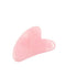 Pink rose quartz gua sha facial massage tool with smooth, curved edges on white background
