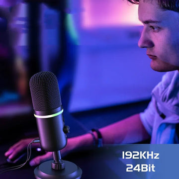 Man in casual streetwear using a high-tech desktop microphone, gaming setup background