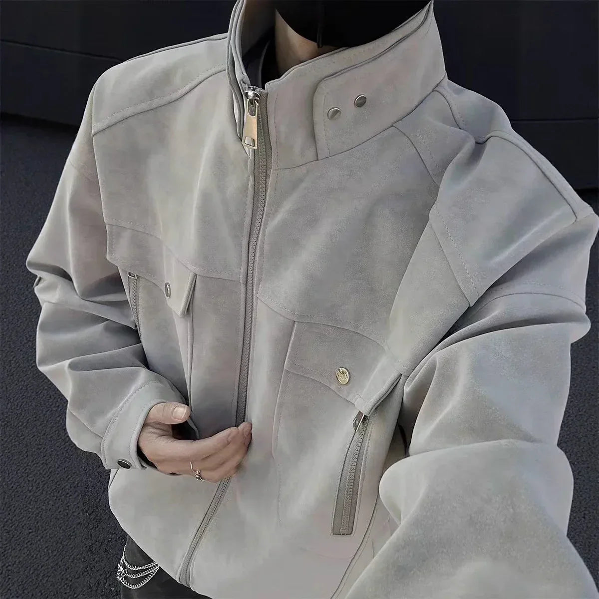 Oversized light gray suede jacket with zip front, button collar, and chest pockets, streetwear style
