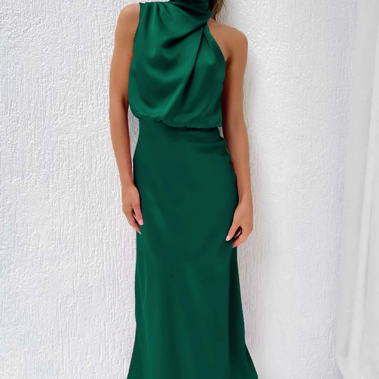 Sleeveless emerald green satin maxi dress with draped halter neckline and slim fit
