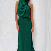 Sleeveless emerald green satin maxi dress with draped halter neckline and slim fit