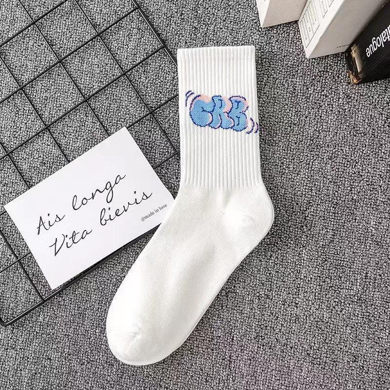 White ribbed crew sock with blue graffiti-style graphic, cotton material, streetwear style