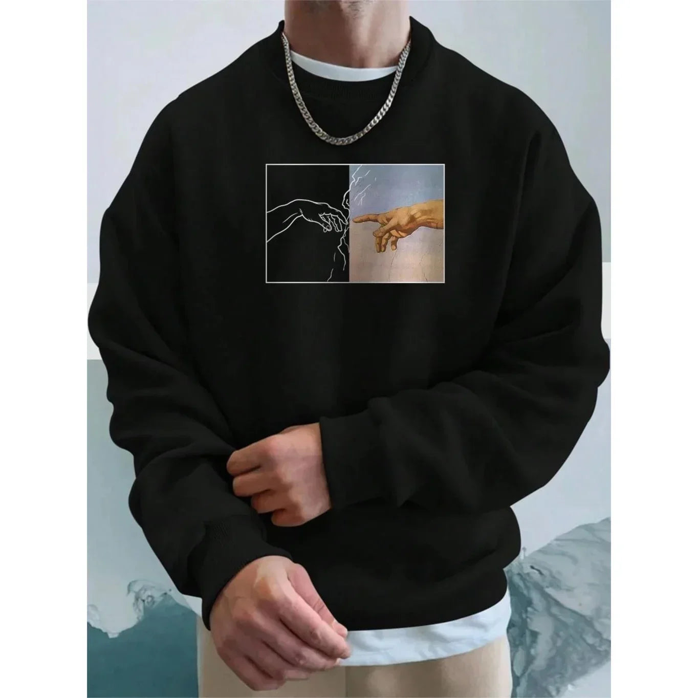 Black oversized sweatshirt with artistic graphic print, crew neck, relaxed fit, streetwear style