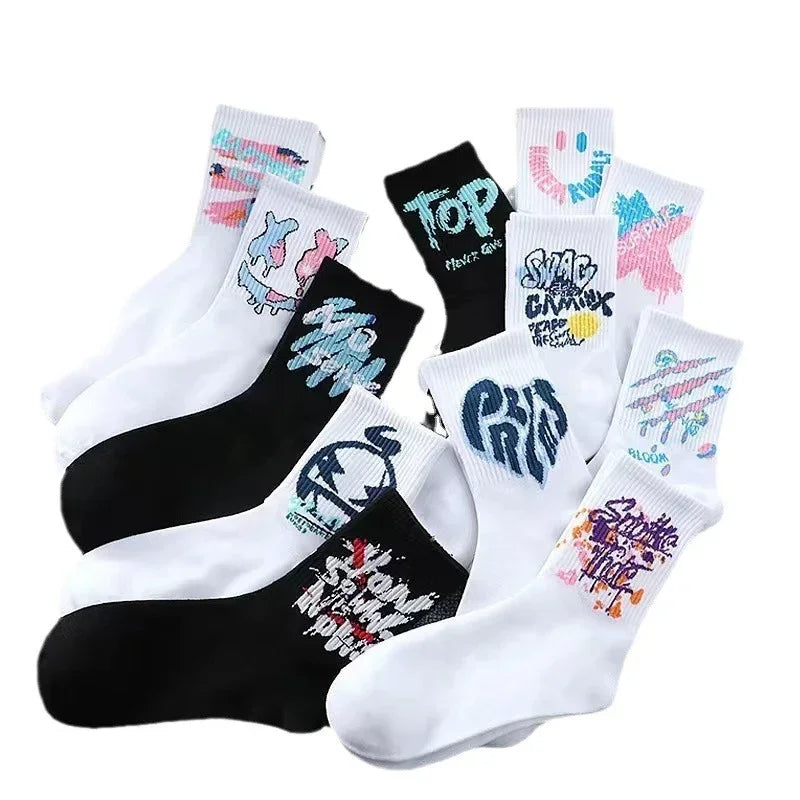 Assorted white and black socks with bold, colorful graphic prints and streetwear style designs.