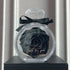 Black preserved rose in clear diamond-shaped case with black ribbon, modern gift decor
