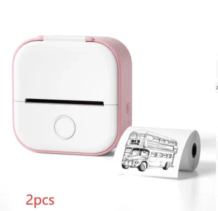 Compact pink and white portable thermal printer with printed bus illustration and extra paper roll